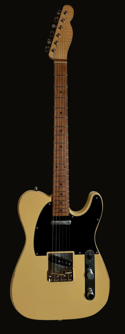 T-style in TV Yellow, black pickguard, single-coil bridge pickup, maple-look fingerboard — front
