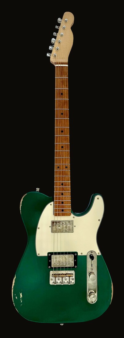 T-style in metallic green, two humbuckers, cream pickguard, plum fingerboard — front